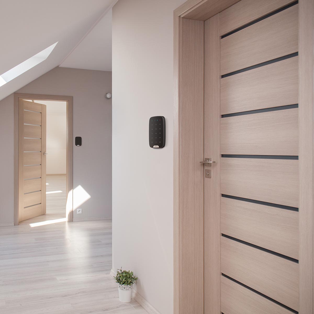 Ajax wireless KeyPad, black (CP430B) — Keypad mounted beside a door